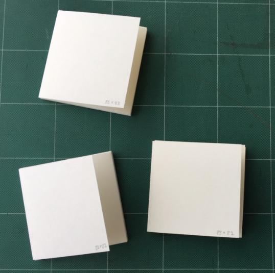 Three small four-flap folders for lantern slides